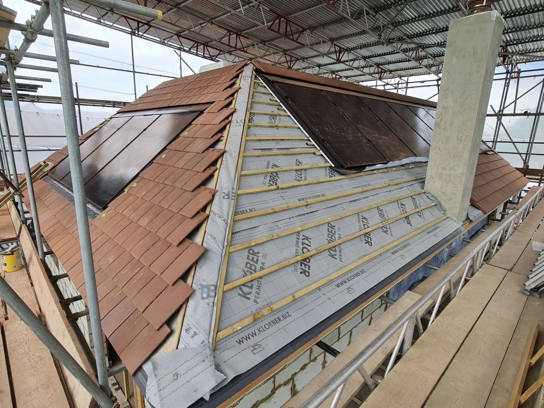 Roof covering and solar panel installation